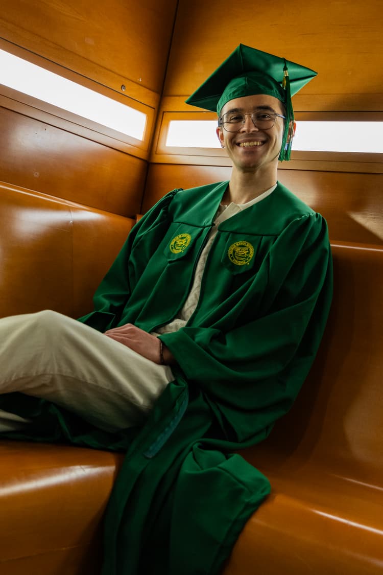 smiling grad sitting