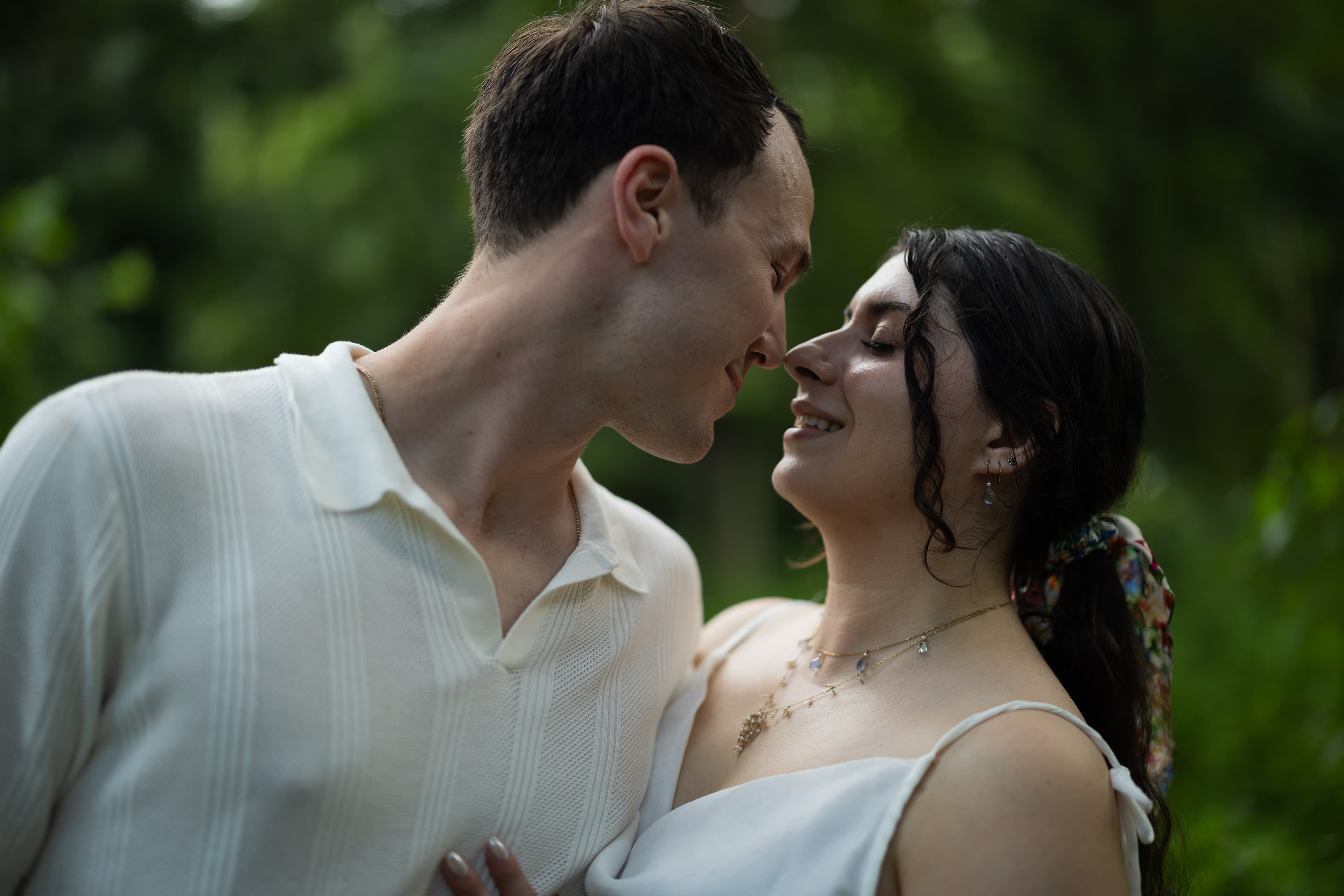 A newly wed couple shares a close embrace.